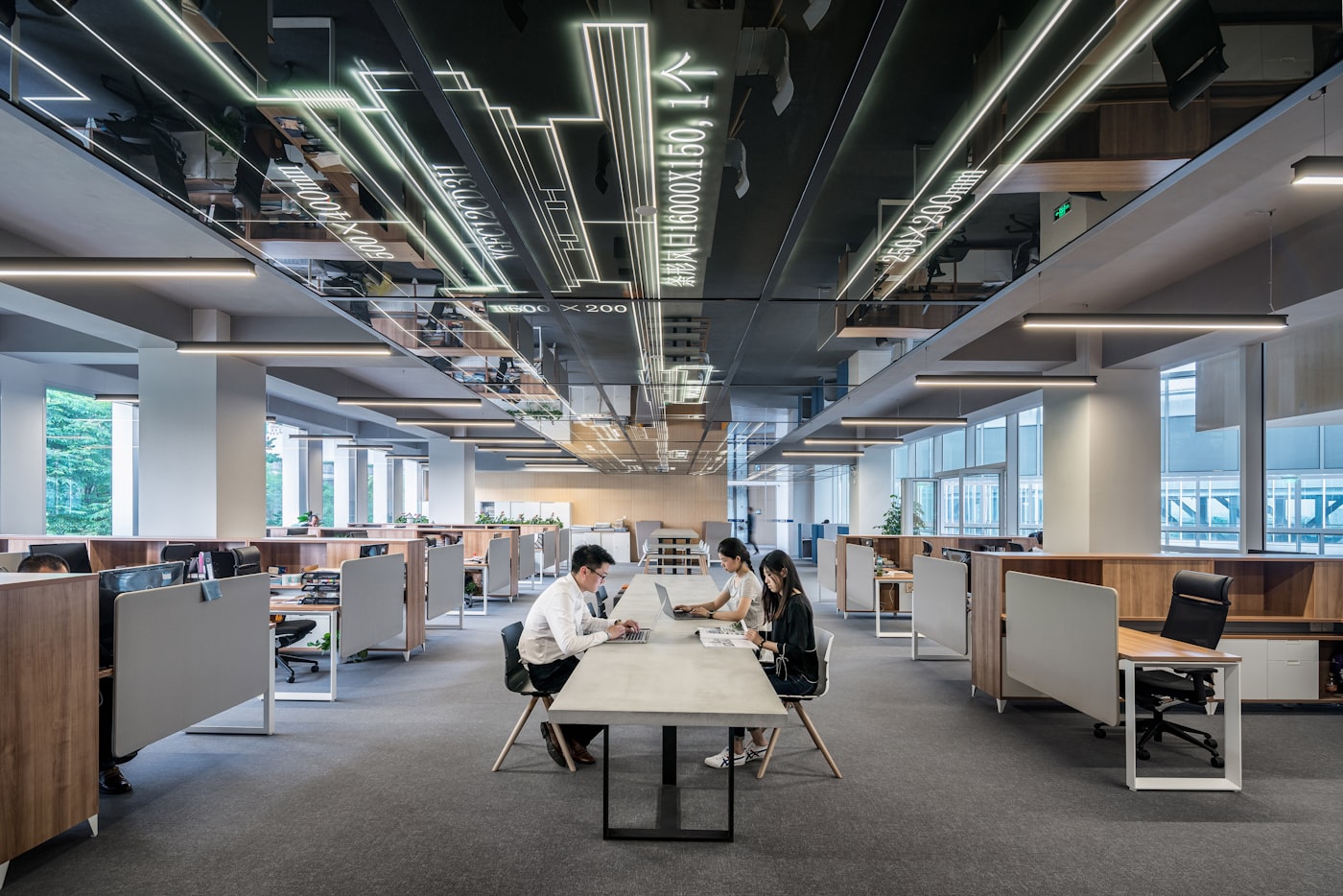 Modern open-plan technology office with a team collaborating